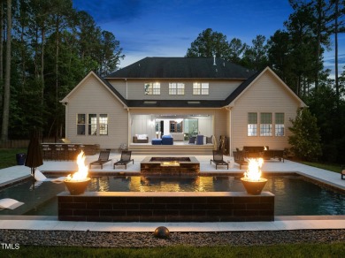 Experience luxury and lifestyle in this exceptional 5-bedroom, 5 on Hasentree Club in North Carolina - for sale on GolfHomes.com, golf home, golf lot