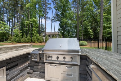 Experience luxury and lifestyle in this exceptional 5-bedroom, 5 on Hasentree Club in North Carolina - for sale on GolfHomes.com, golf home, golf lot