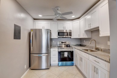 Walking distance to House of Worship remodeled 2nd floor condo on Kings Point Golf -Flanders Way in Florida - for sale on GolfHomes.com, golf home, golf lot