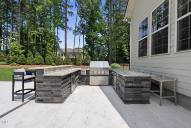 Experience luxury and lifestyle in this exceptional 5-bedroom, 5 on Hasentree Club in North Carolina - for sale on GolfHomes.com, golf home, golf lot