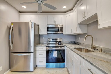 Walking distance to House of Worship remodeled 2nd floor condo on Kings Point Golf -Flanders Way in Florida - for sale on GolfHomes.com, golf home, golf lot