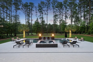 Experience luxury and lifestyle in this exceptional 5-bedroom, 5 on Hasentree Club in North Carolina - for sale on GolfHomes.com, golf home, golf lot