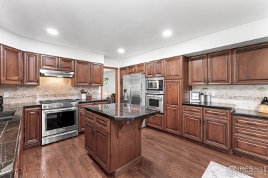 Elegantly positioned on a spacious corner lot in coveted Paragon on Southridge Golf Club in Colorado - for sale on GolfHomes.com, golf home, golf lot