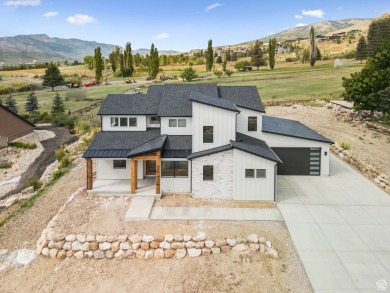 Luxury Golf Course Home in Eden! This stunning 6-bedroom, 4 on Wolf Creek Golf Club and Resort in Utah - for sale on GolfHomes.com, golf home, golf lot