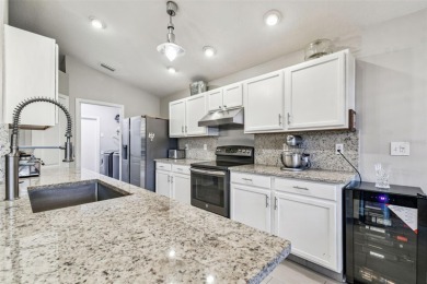 Beautifully renovated, gated, GOLF course views on Lexington Oaks Golf Club in Florida - for sale on GolfHomes.com, golf home, golf lot