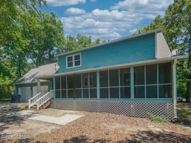 Discover your coastal retreat at 801 Elizabeth Drive, nestled in on Oak Island Golf Club in North Carolina - for sale on GolfHomes.com, golf home, golf lot