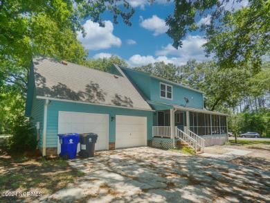 Discover your coastal retreat at 801 Elizabeth Drive, nestled in on Oak Island Golf Club in North Carolina - for sale on GolfHomes.com, golf home, golf lot