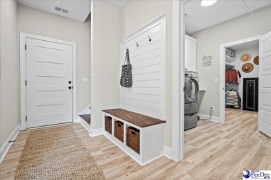 What a beautiful home! The stone entry way brings warmth and on Hartsville Country Club in South Carolina - for sale on GolfHomes.com, golf home, golf lot