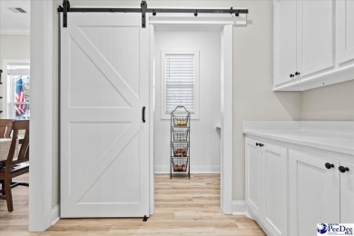 What a beautiful home! The stone entry way brings warmth and on Hartsville Country Club in South Carolina - for sale on GolfHomes.com, golf home, golf lot