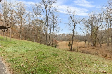 Tucked away in the woods, this 2-bedroom, 2-bathroom home on on River Oaks Country Club in North Carolina - for sale on GolfHomes.com, golf home, golf lot