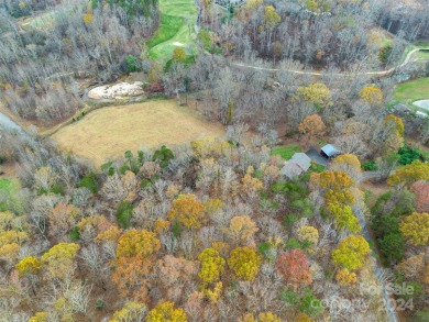 Tucked away in the woods, this 2-bedroom, 2-bathroom home on on River Oaks Country Club in North Carolina - for sale on GolfHomes.com, golf home, golf lot