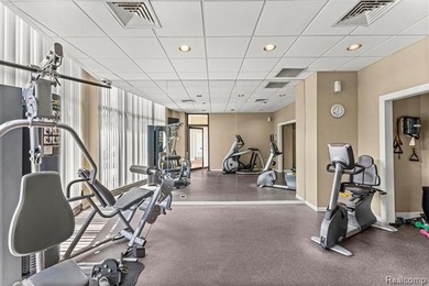 Welcome to this remarkable 2-bedroom, 2-bath residence located on Evergreen Hills Golf Course in Michigan - for sale on GolfHomes.com, golf home, golf lot