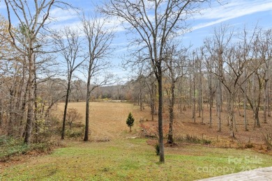 Tucked away in the woods, this 2-bedroom, 2-bathroom home on on River Oaks Country Club in North Carolina - for sale on GolfHomes.com, golf home, golf lot