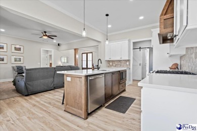 What a beautiful home! The stone entry way brings warmth and on Hartsville Country Club in South Carolina - for sale on GolfHomes.com, golf home, golf lot