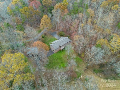 Tucked away in the woods, this 2-bedroom, 2-bathroom home on on River Oaks Country Club in North Carolina - for sale on GolfHomes.com, golf home, golf lot