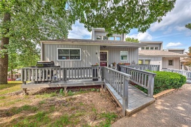 Discover this end-unit townhome with seasonal views of Lake on Bella Vista Country Club - Berksdale in Arkansas - for sale on GolfHomes.com, golf home, golf lot
