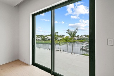 Welcome to a modern masterpiece in the prestigious Admirals Cove on Jonathans Landing Golf Club in Florida - for sale on GolfHomes.com, golf home, golf lot