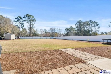 What a beautiful home! The stone entry way brings warmth and on Hartsville Country Club in South Carolina - for sale on GolfHomes.com, golf home, golf lot