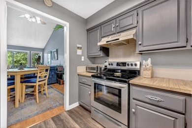Discover this end-unit townhome with seasonal views of Lake on Bella Vista Country Club - Berksdale in Arkansas - for sale on GolfHomes.com, golf home, golf lot