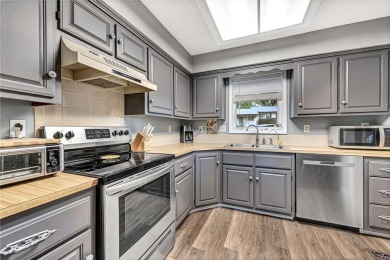 Discover this end-unit townhome with seasonal views of Lake on Bella Vista Country Club - Berksdale in Arkansas - for sale on GolfHomes.com, golf home, golf lot