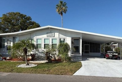 Beautifully maintained 2-bedroom, 2-bath home offering comfort on Lake Henry Golf Club in Florida - for sale on GolfHomes.com, golf home, golf lot