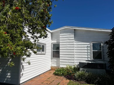 Beautifully maintained 2-bedroom, 2-bath home offering comfort on Lake Henry Golf Club in Florida - for sale on GolfHomes.com, golf home, golf lot