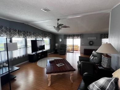 Beautifully maintained 2-bedroom, 2-bath home offering comfort on Lake Henry Golf Club in Florida - for sale on GolfHomes.com, golf home, golf lot