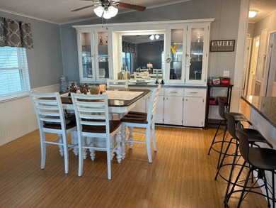 Beautifully maintained 2-bedroom, 2-bath home offering comfort on Lake Henry Golf Club in Florida - for sale on GolfHomes.com, golf home, golf lot