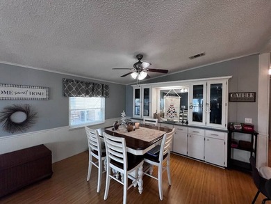 Beautifully maintained 2-bedroom, 2-bath home offering comfort on Lake Henry Golf Club in Florida - for sale on GolfHomes.com, golf home, golf lot