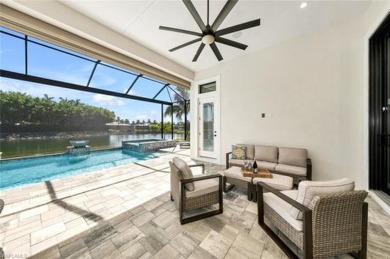 Open-concept waterfront single-family home in #1 Miromar Lakes on Miromar Lakes Golf Club in Florida - for sale on GolfHomes.com, golf home, golf lot