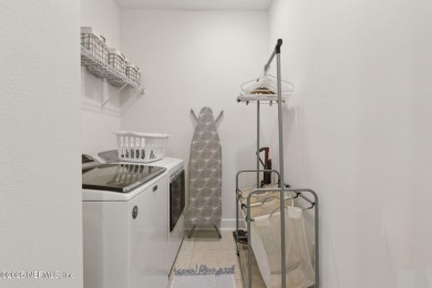 This beautifully designed 3-bedroom, 2-bath home sits on a on Golf Club At South Hampton in Florida - for sale on GolfHomes.com, golf home, golf lot