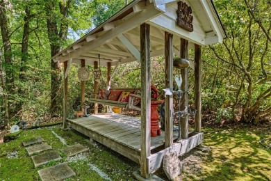 Lovely one story home with a beautiful level yard with mature on Wildcat Cliffs Country Club in North Carolina - for sale on GolfHomes.com, golf home, golf lot