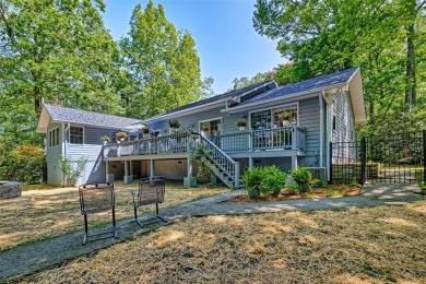 Lovely one story home with a beautiful level yard with mature on Wildcat Cliffs Country Club in North Carolina - for sale on GolfHomes.com, golf home, golf lot