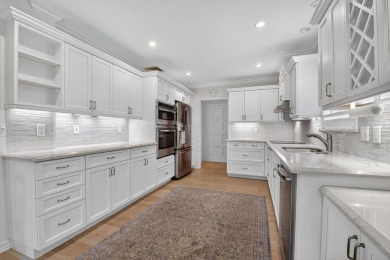 THIS COMPLETELY REMODELED VILLA HAS WIDE OPEN VIEWS OF THE 15TH on Delray Dunes Golf and Country Club in Florida - for sale on GolfHomes.com, golf home, golf lot