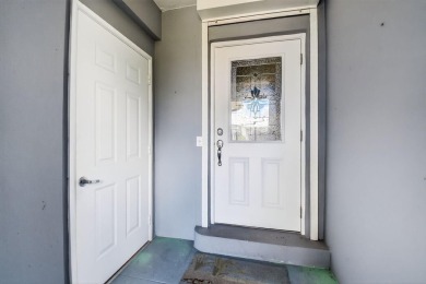 THIS COMPLETELY REMODELED VILLA HAS WIDE OPEN VIEWS OF THE 15TH on Delray Dunes Golf and Country Club in Florida - for sale on GolfHomes.com, golf home, golf lot