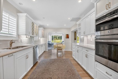 THIS COMPLETELY REMODELED VILLA HAS WIDE OPEN VIEWS OF THE 15TH on Delray Dunes Golf and Country Club in Florida - for sale on GolfHomes.com, golf home, golf lot