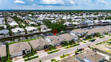 Under contract-accepting backup offers. 1028 Signet Drive on Apollo Beach Golf and Sea Club in Florida - for sale on GolfHomes.com, golf home, golf lot