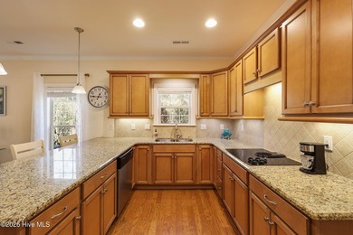 Bright & cheery end unit townhome with low maintenance brick on Cape Fear National At Brunswick Forest in North Carolina - for sale on GolfHomes.com, golf home, golf lot