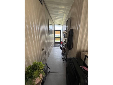 This 2-bedroom, 2-bath home has been remodeled in the last year on Grasslands Golf and Country Club in Florida - for sale on GolfHomes.com, golf home, golf lot