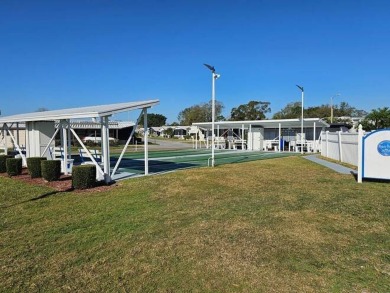 This 2-bedroom, 2-bath home has been remodeled in the last year on Grasslands Golf and Country Club in Florida - for sale on GolfHomes.com, golf home, golf lot