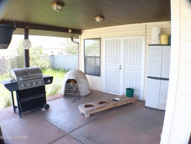 This home backs the fairway of Snowflake's Country Club golf on Snowflake Municipal Golf Course in Arizona - for sale on GolfHomes.com, golf home, golf lot