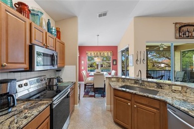 Golf membership included with purchase. This 2nd floor end unit on Pelican Sound Golf and River Club in Florida - for sale on GolfHomes.com, golf home, golf lot