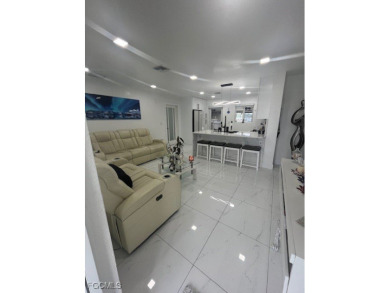 Welcome to your Dream Home! Fully remodeled in 2022, this home on Trump International Golf Club West Palm Beach in Florida - for sale on GolfHomes.com, golf home, golf lot