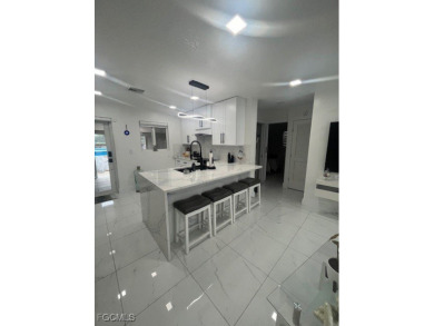 Welcome to your Dream Home! Fully remodeled in 2022, this home on Trump International Golf Club West Palm Beach in Florida - for sale on GolfHomes.com, golf home, golf lot
