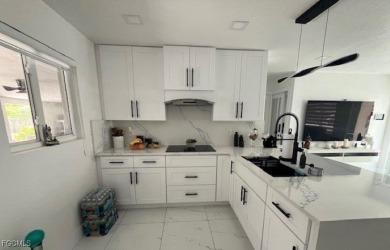 Welcome to your Dream Home! Fully remodeled in 2022, this home on Trump International Golf Club West Palm Beach in Florida - for sale on GolfHomes.com, golf home, golf lot