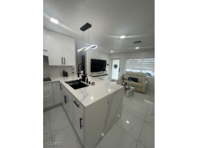 Welcome to your Dream Home! Fully remodeled in 2022, this home on Trump International Golf Club West Palm Beach in Florida - for sale on GolfHomes.com, golf home, golf lot