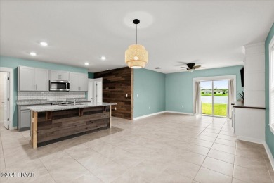 LAKEFRONT 5-bedroom, 3-bathroom, 2-car garage, concrete block on Venetian Bay Golf Course in Florida - for sale on GolfHomes.com, golf home, golf lot