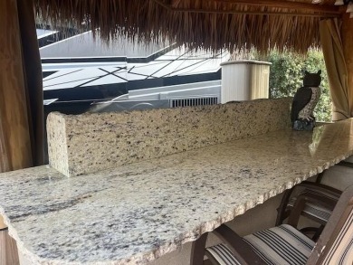 Beautiful landscaped . Large granite bar for wonderful outdoor on St. Lucie Trail Golf Club in Florida - for sale on GolfHomes.com, golf home, golf lot