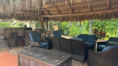 Beautiful landscaped . Large granite bar for wonderful outdoor on St. Lucie Trail Golf Club in Florida - for sale on GolfHomes.com, golf home, golf lot