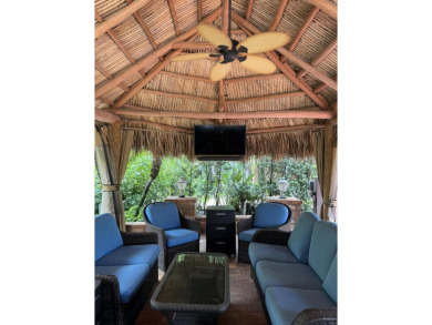 Beautiful landscaped . Large granite bar for wonderful outdoor on St. Lucie Trail Golf Club in Florida - for sale on GolfHomes.com, golf home, golf lot